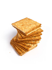Stack of crackers on white background
