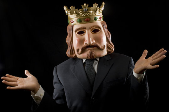 Businessman with king mask surprised