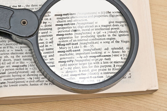 Magnifier glass and dictionary