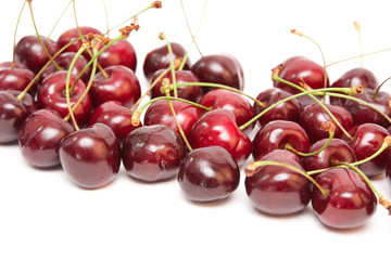 group of red cherries isolated on white