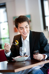 Man with Salad and Phone