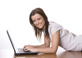 Smiling woman using her laptop