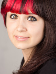 Teenager with dyed red hair