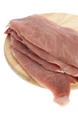 Schweinefleisch auf Küchenbrett