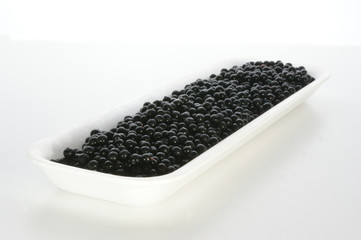 elderberries on a styrofoam container