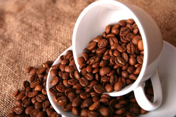 cup, dish and beans of coffee