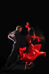 dancer in action against black background