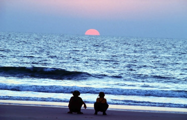 2 Hippies watching the sunset in Goa