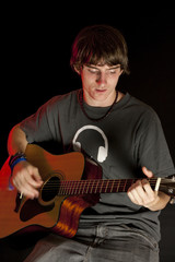 Teen Playing Guitar