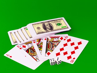 The dice and playing cards-poker on green broadcloth.