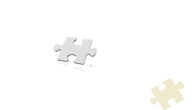 gold and silver puzzle piece falling
