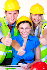 Team with hard hats looking at the camera