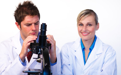 Science students looking through a microscope