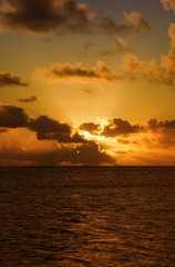 Sunset behind dark Clouds over Sea