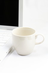 tea cup and MacBook