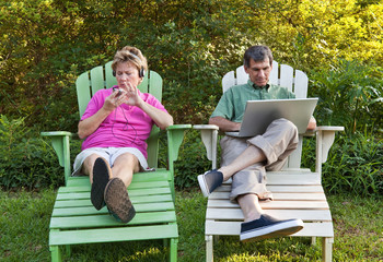 Mature Couple with Their Electronic Devices
