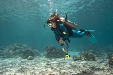 Fotobehang Duikers in koraalrif   © New Media & Films