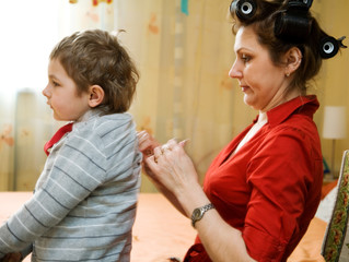combing her son hair