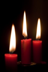 Fototapeta na wymiar Three burning candles