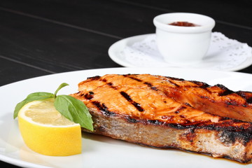 Grilled salmon on the white plate