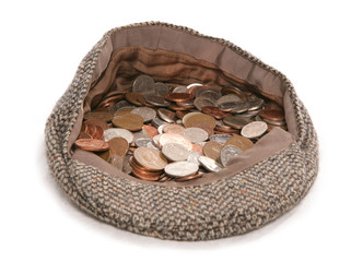 busking flat cap with british currency money
