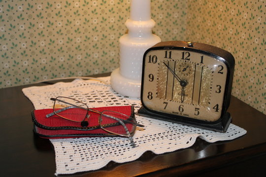 clock and glasses bedstand