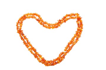 Obraz premium Amber beads double frame in shape of heart isolated