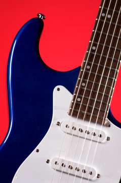 Guitar Blue Electric Isolated on Red