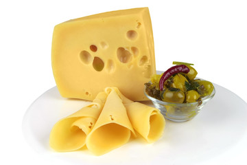 big yellow cheese chunk and slices with olives