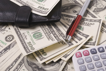 Money, purse, pen and calculator