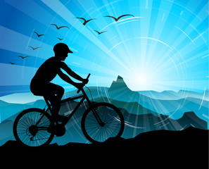 Naklejka na ściany i meble Biker Silhouette with mountains