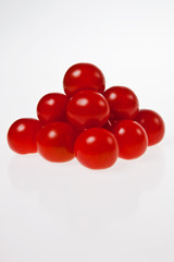 A tomato pyramid isolated on white background.