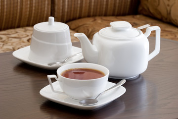 Obraz na płótnie Canvas cups of tea with a teapot and spoon