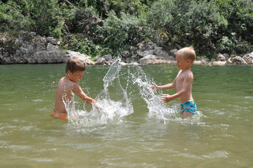 Two boys playing with water