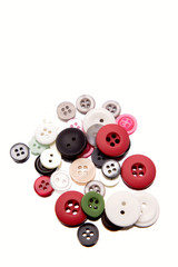 Assorted buttons on white background