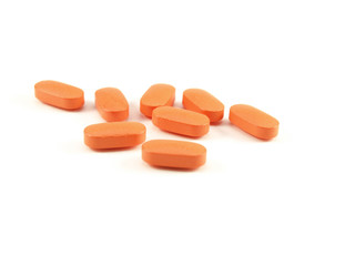 Obraz na płótnie Canvas Pigułki pomarańczowy, leki na receptę na białym tle