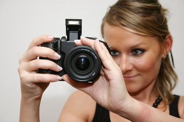 cute girl with digital camera