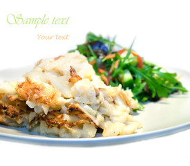 Serving of potato gratin and mixed salad