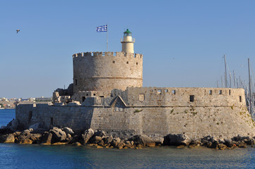 lighthouse and fortress on Rhodes island.port Mandraki