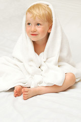 Little child in white towel