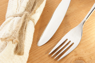fork and knife on timber background