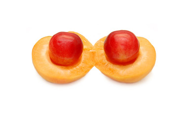 Apricot and sweet cherry on a white background