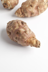 Topinambur (Helianthus tuberosus)on white background