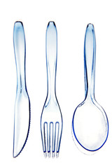Plastic knife, fork and spoon on white