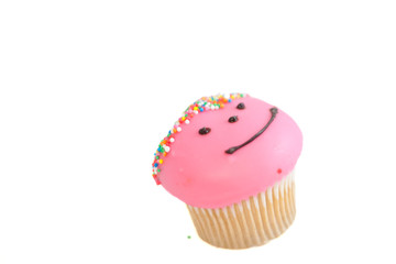 Pink cupcake isolated on white
