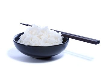 Black bowl with white rice and chop sticks