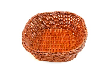 Fototapeta premium Empty orange wicker basket without handles isolated