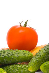 Fresh tomato, cucumbers and potatoes on studio white