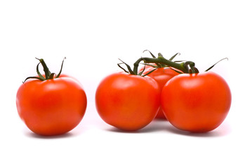 Fresh tomatoes. Macro studio isolated on white.
