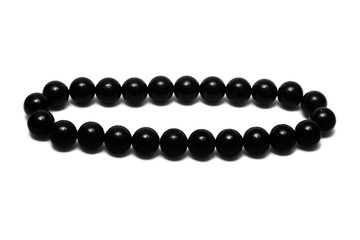 Black beads isolated on white background